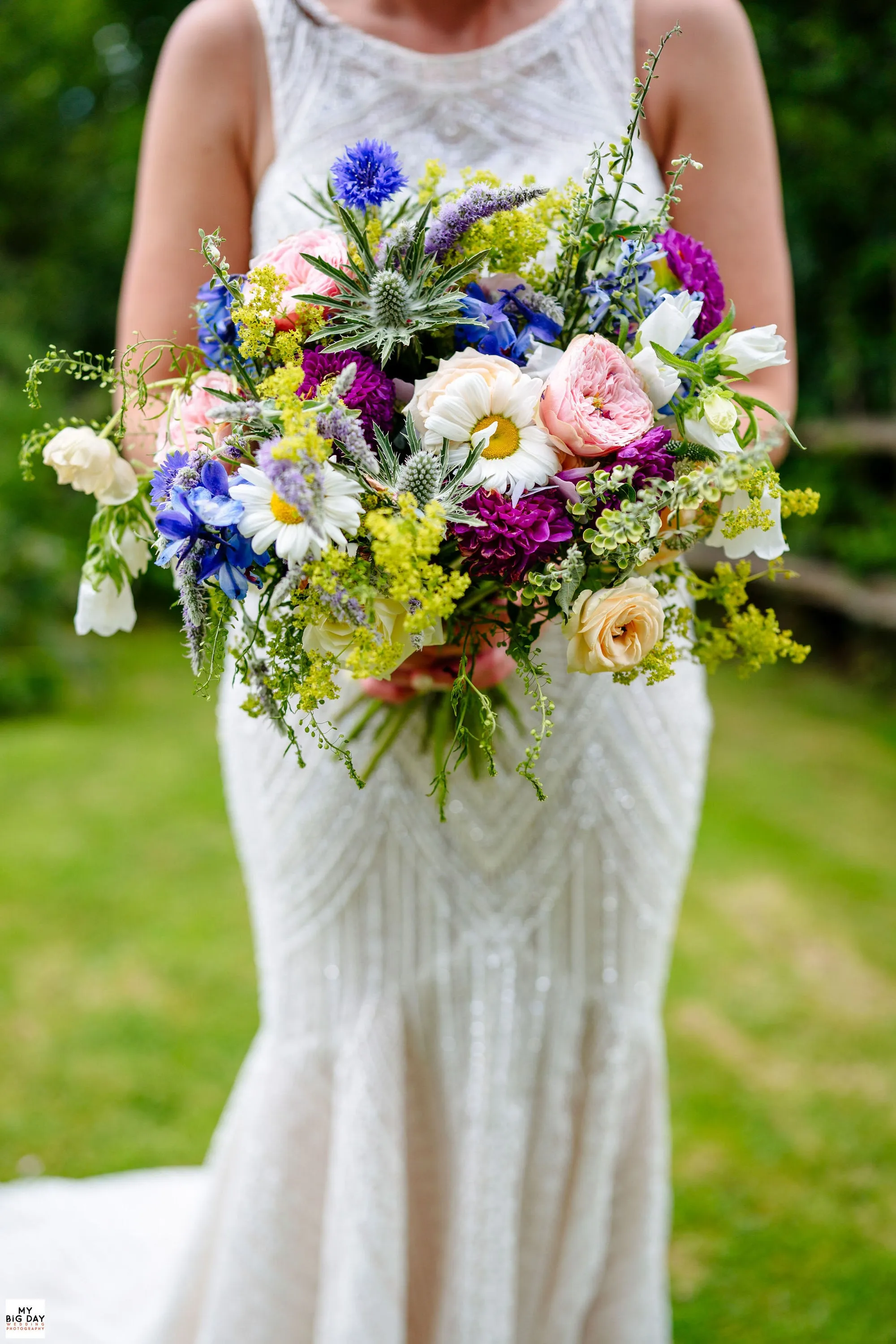 A wildflower bridal bouquet in blues and yellows